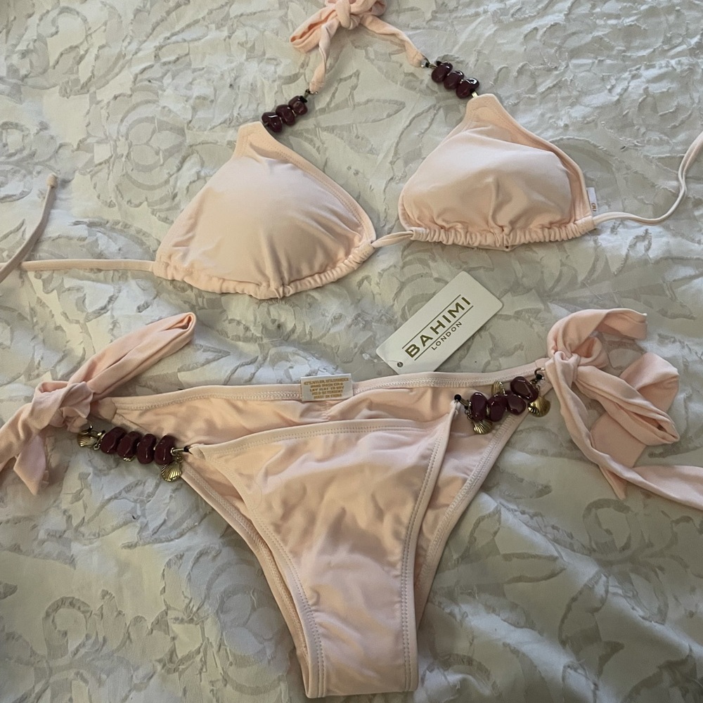 Bahimi  blush pink bikini with burgundy stone and gold charm accents. Size S.